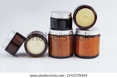 A set of different aroma candles in glass jars on a white background. Scented handmade candle. Soy, wax and paraffin candles. Royalty-Free Stock Photo #2142378469