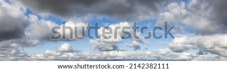 View of Cloudscape during a cloudy blue sky sunny day. Taken on the West Coast of British Columbia, Canada. Panorama Background
