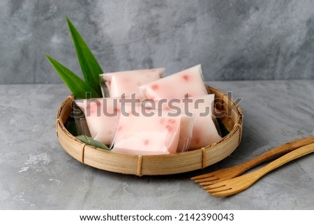 Cente Manis, Cantik Manis, or Jentik Manis.  Traditional Indonesian Snack. ingredient hunkwe flour, sugar mixed with tapioca pearls. Royalty-Free Stock Photo #2142390043