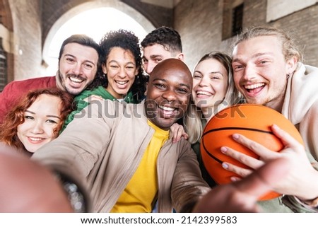 Multiracial friends taking selfie group photo outside - Friendship concept with guys and girls having fun together on city street - Group of young people hanging out enjoying summer vacations