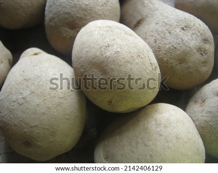 potato vegetables piled up and dirty, not taken care of