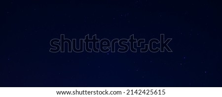 Amazing crescent moon on dark blue night sky background, universe full of stars, nebula and galaxies with noise and grainy selection focus.