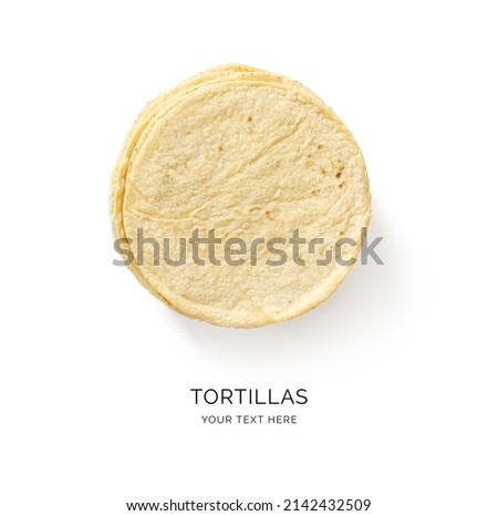 Creative layout made of corn tortilla on the white background. Flat lay. Food concept. Macro  concept. Royalty-Free Stock Photo #2142432509