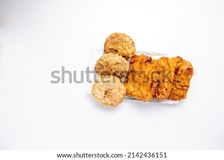 fried banana and gandasturi snacks (from green beans which are softened and coated with flour and then fried), white background