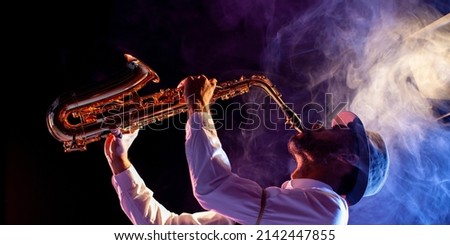 Feeling the music. Jazz musician. Saxophone. Royalty-Free Stock Photo #2142447855