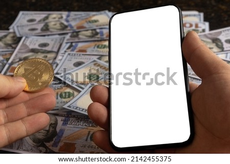 old money and new money. American dollars and bitcoin. cell phone screen with space for text 
