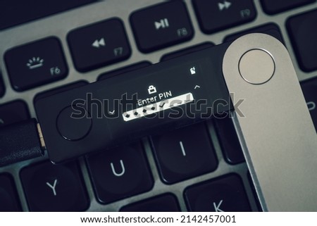 Hardware Wallet for cryptocurrency on keyboard for pin code Royalty-Free Stock Photo #2142457001