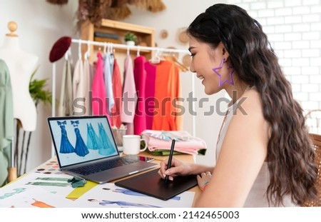 Beautiful asian woman fashion designer working in office studio. entrepreneur sme business concept.
