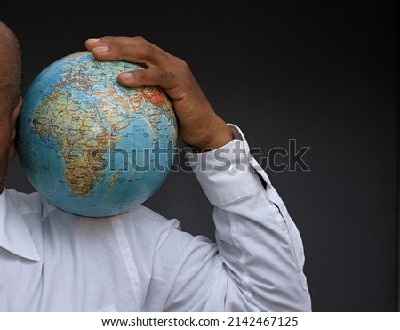 hand holding globe of the world with background stock photo 