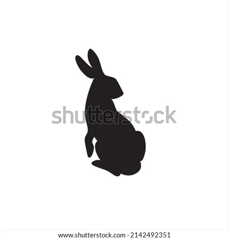 Black silhouette of sitting hare, rabbit, bunny. Vector illustration isolated on white background.	