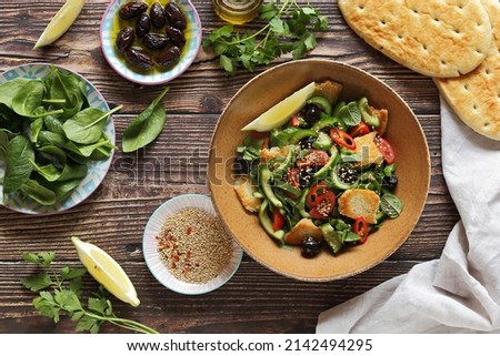 Fattoush Salad. Lebanese vegetables salad with roasted flatbread. Selective focus