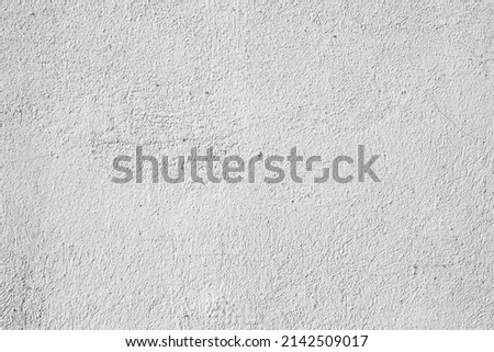 Plastered light gray wall surface background with scratches and cracks. High resolution grungy wall texture. 