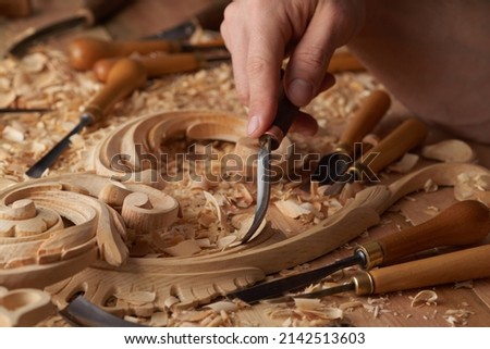 Carpenter wood carving equipment. Woodworking, craftsmanship and handwork concept. Wood processing. Joinery work Wood carving Chisels for carving on the woodworker desk Timber Joinery work. Royalty-Free Stock Photo #2142513603