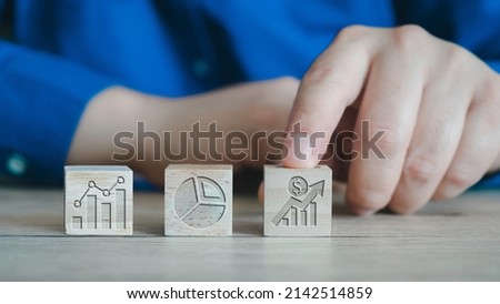 Businessman analysing economic growth graph financial data on laptop. Stock market investment. Financial and banking Technology. Business strategy and digital marketing concept.