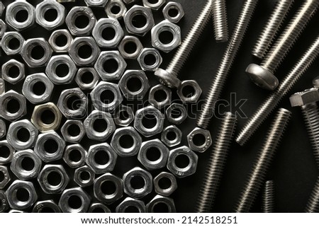 Chromed screw nuts isolated. Steel nuts pattern. Set of Nuts and bolts. Tools for work. Black and white. Different tools with place for text.