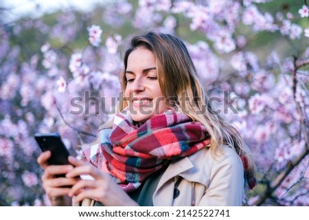 Woman attending social media with colorful background