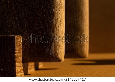 Abstract warm color background with long shadows on the wall and geometric shapes. High quality horizontal photo