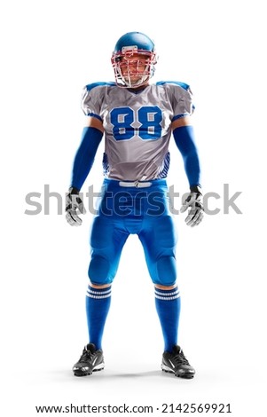 Brutal an American football player stands in white background. Isolated on white. Sports emotions