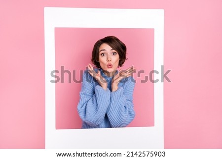 Portrait of pretty excited lady hands palms pouted lips card camera set shooting isolated on pink color background