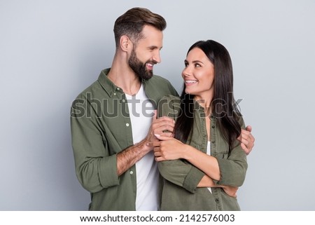 Photo of positive warmth spouses guy cuddle his lady enjoy togetherness honeymoon isolated over grey color background Royalty-Free Stock Photo #2142576003