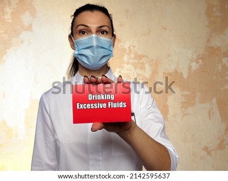 Healthcare concept about Drinking Excessive Fluids with phrase on the page.
