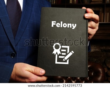  Juridical concept about Felony with phrase on the page.
 Royalty-Free Stock Photo #2142595773