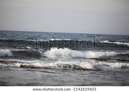 low waves on the shore of a beach High quality 