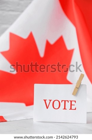 The National Flag of Canada. Canadian Flag or the Maple Leaf with paper note message text. Election day, give vote, your vote matters counts, vote is voice. Be responsible. Voting government