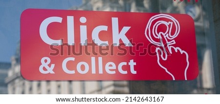 Click and Collect sign text sticker on shop street order shopping online and collect from a local store for free