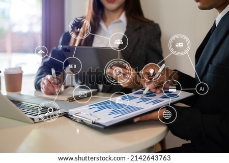 Business team present. professional investor working new start up project. .Digital tablet laptop computer Finance managers meeting with digital marketing media  in virtual icon  Royalty-Free Stock Photo #2142643763