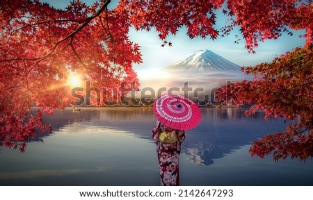 Colorful Autumn Season and Mountain Fuji with Asian woman wearing japanese traditional kimono at lake Kawaguchiko is one of the best places in Japan