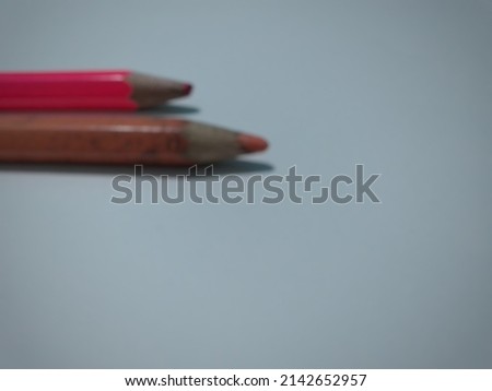 Defocused abstract background of pencils