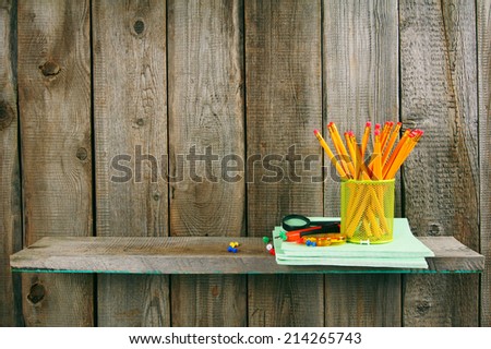 School accessories. On a wooden background.