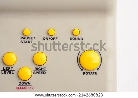 Vintage video game control console with buttons                              