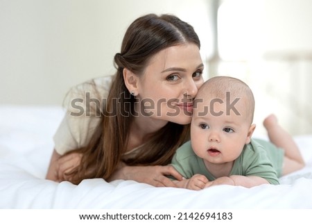 A woman with a small child. Mom with a baby. High quality photo