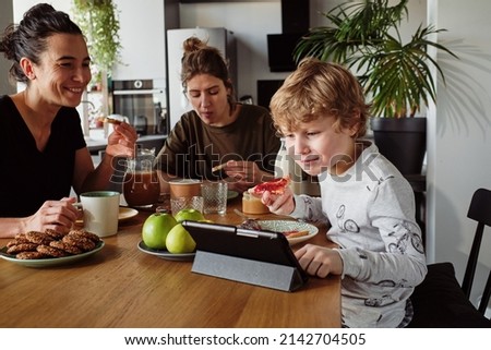 Boy having breakfast with parents