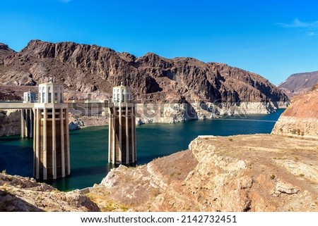 Hoover Dam and penstock towers in Colorado river at Nevada and Arizona border, USA Royalty-Free Stock Photo #2142732451