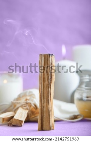 Palo Santo bars close-up and copy space. Ritual cleansing with sacred ibiocai, meditation, aromatherapy with incense and candles.