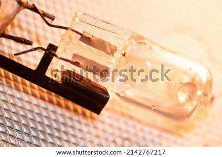 Close up of an electric bulb isolated in background with pattern, Transparent realistic light bulb isolated with fine details and high resolution