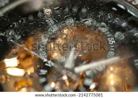 Closeup of an expensive watch isolated in background, Details of a watch machinery on the table, high resolution details of an expensive watch