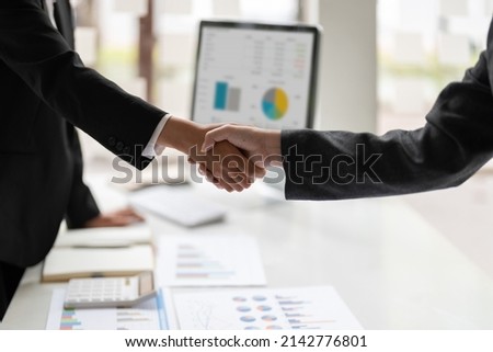 Business people colleagues shaking hands during a meeting to sign agreement for New Partner Planning Strategy Analysis Concept