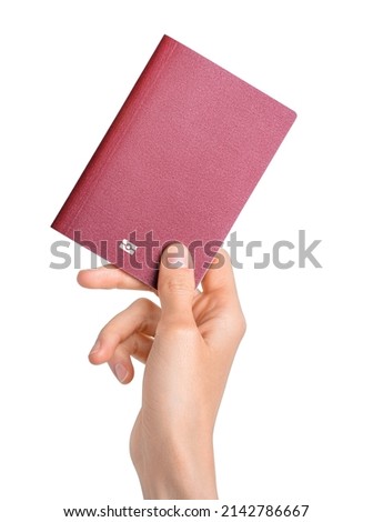 Hand holding passport isolated on white background. Documents, visa, citizenship or emigration concept. Clipping path Royalty-Free Stock Photo #2142786667
