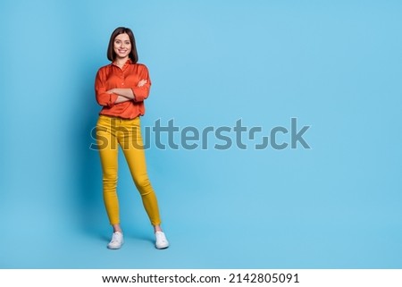 Full body photo of young pretty girl crossed hands smart employer promoter isolated over blue color background