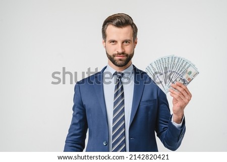 Prosperity wealth rich caucasian businessman ceo millionaire in formalwear suit holding money, buying expensive goods looking at camera isolated in white background Royalty-Free Stock Photo #2142820421