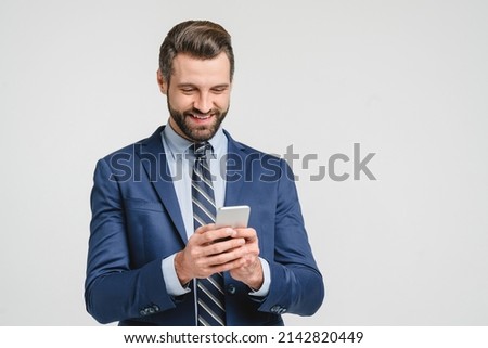 Caucasian young businessman ceo bank worker employee freelancer financial adviser in formalwear using smart phone cellphone for online mobile applications, calls isolated in white Royalty-Free Stock Photo #2142820449