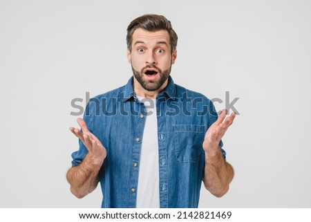 Shocked disappointed caucasian young man expressing emotions for sale discount, hearing good bad news isolated in white background Royalty-Free Stock Photo #2142821469