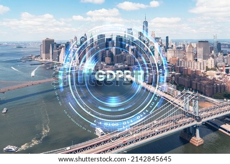 Aerial panoramic city view of Lower Manhattan. Brooklyn and Manhattan bridges over East River, New York, USA. GDPR hologram, concept of data protection regulation and privacy for all individuals