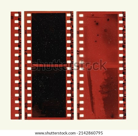 35mm Red Negative Photo Film Stripes Frame Gritty Scan Pieces. Royalty-Free Stock Photo #2142860795