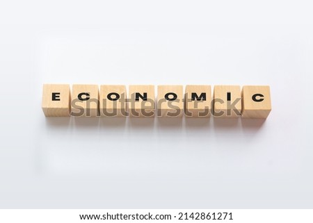 ECONOMIC cube blocks on white background. Wooden blocks with the word ECONOMIC. Economic wood cube - Business Concept
