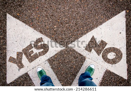 Yes or no dilemma concept with man legs from above standing on signs